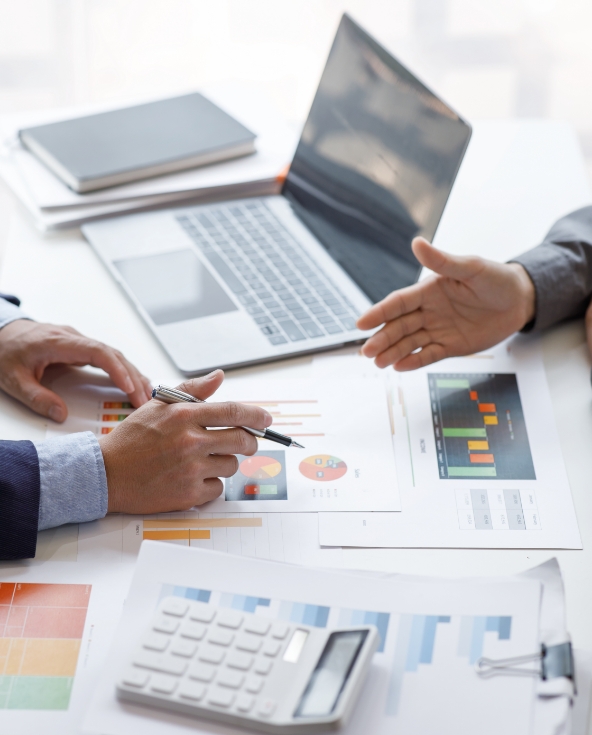 Closeup shot of accountants working on financial reports.