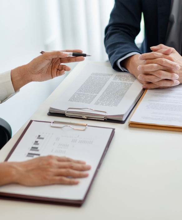 Two financial professionals in discussion.